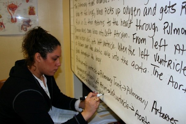 Learner working through healthcare concepts